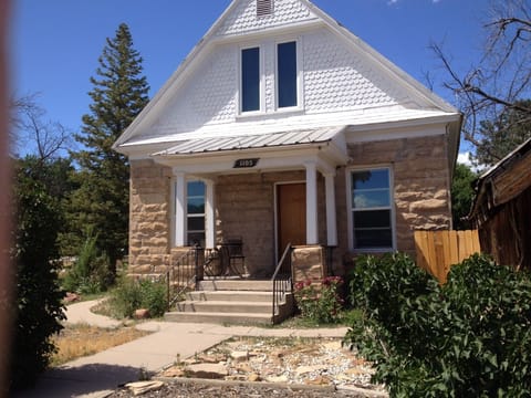 Front porch provides a quiet area to relax & enjoy the sun, from dawn 'til dusk