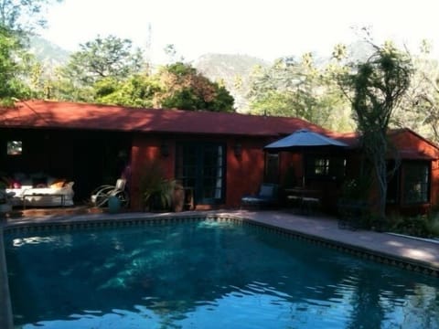 outdoor living & dining areas with views to San Gabriel Mts from spa house