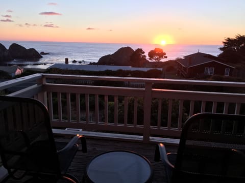 Upstairs balcony overlooking the ocean at sunset