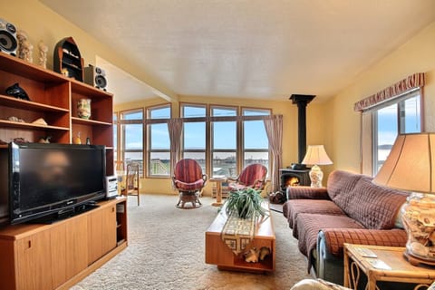 Water views from comfortable living room.  Entertainment Center w/flat screen TV