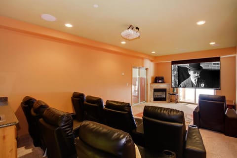 Reclining Theater Chairs, 106' Projector Screen, Fireplace & Recessed Lighting