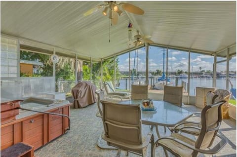 Spacious patio area with hot tub and full size pool table overlooking the Bay