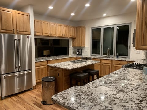 New solid granite countertops and Kitchen Aid Stainless appliances added!