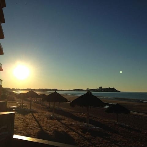 On the beach, sun loungers, beach towels