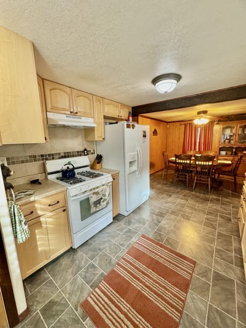 Kitchen with Attached Dining Area that Seats 6