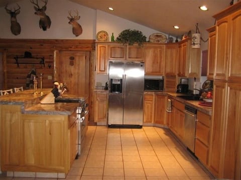 Can you smell the bacon cooking?  This spacious kitchen is fully equipped.
