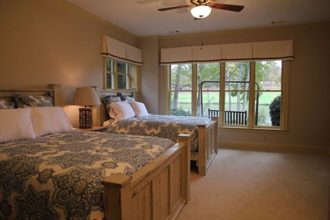 Double queen room with private bath and view of lake and golf course