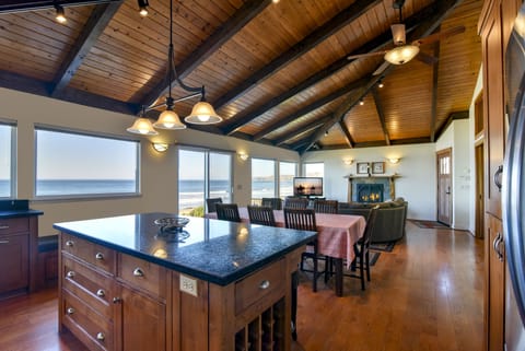 From Living, Dining and Kitchen areas, you have a wall of windows to the ocean.