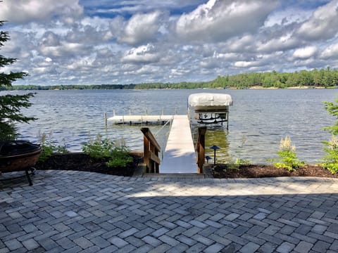 Lake view from lower patio. Firepit pit patio with chairs. Firewood supplied.
