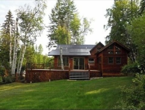 back view of house, huge deck and bunk house