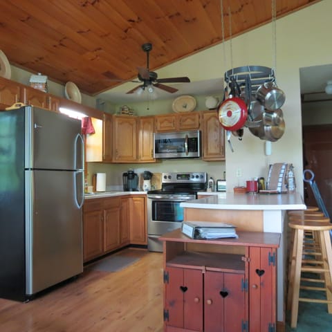Kitchen with accessories...stainless steel appliances, from dining room