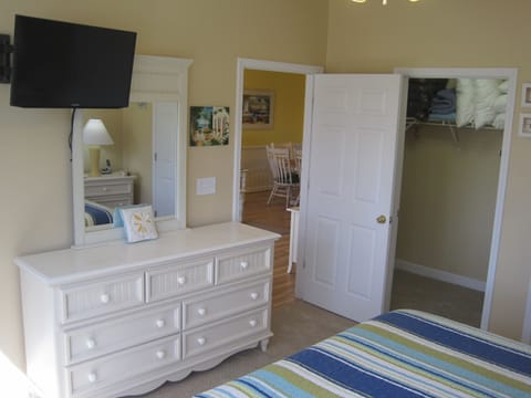 Master Bedroom with Private Bathroom, spacious Walk-In Closet, and 32" TV