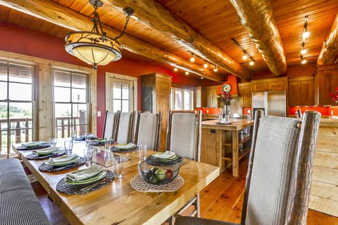 Dining for 10 with bench seat against wall, plus custom chairs.