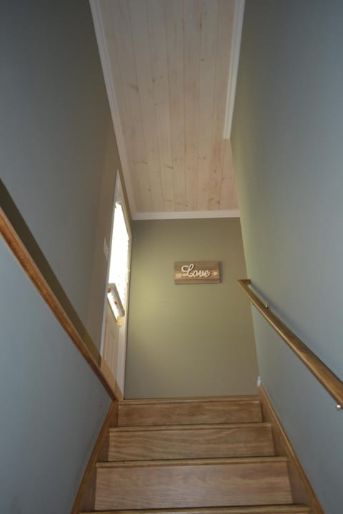 Stairs up to bedrooms and backdoor