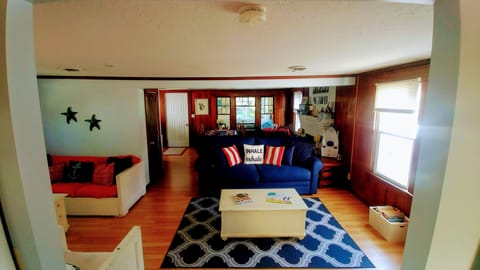 Family Room/Dining Area Looking out from Kitchen to the Screened in Patio