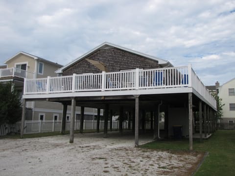 Front of house with spacious deck.