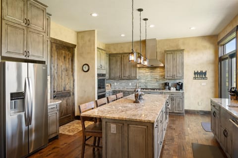 Kitchen island has 4 chairs for additional seating