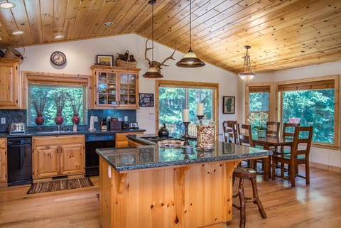 Kitchen and Dining Room; Back Deck features a gas BBQ