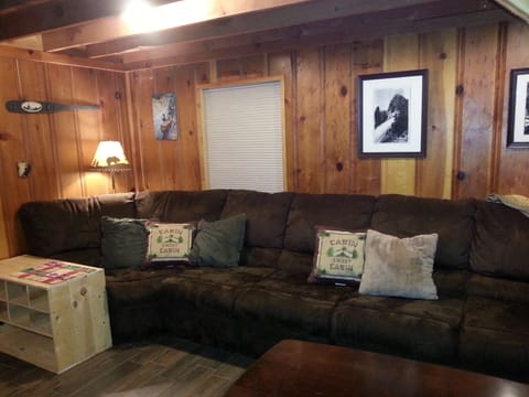 Living room - sectional couch - very comfortable. Seats 6-7 people. Shoe caddy.