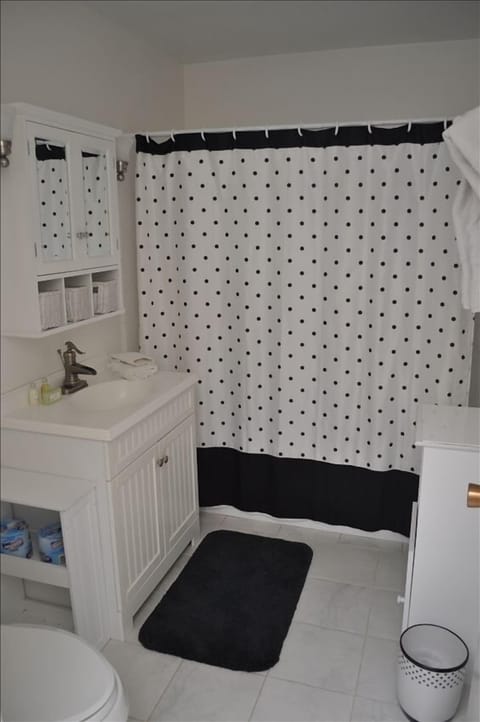 One of two full bathrooms with tub/shower combo