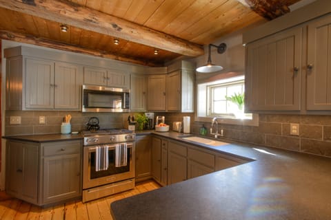 The kitchen. New glass and china - light and roomy.