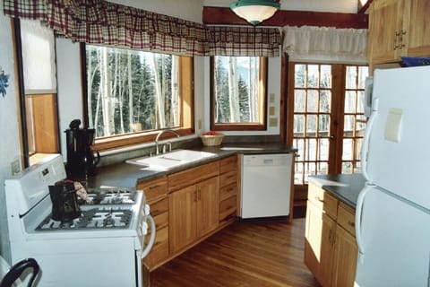Kitchen- French doors and a view deck off the open concept dining area.