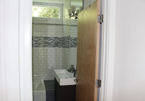 Combined shower/tub, hair dryer, towels, soap