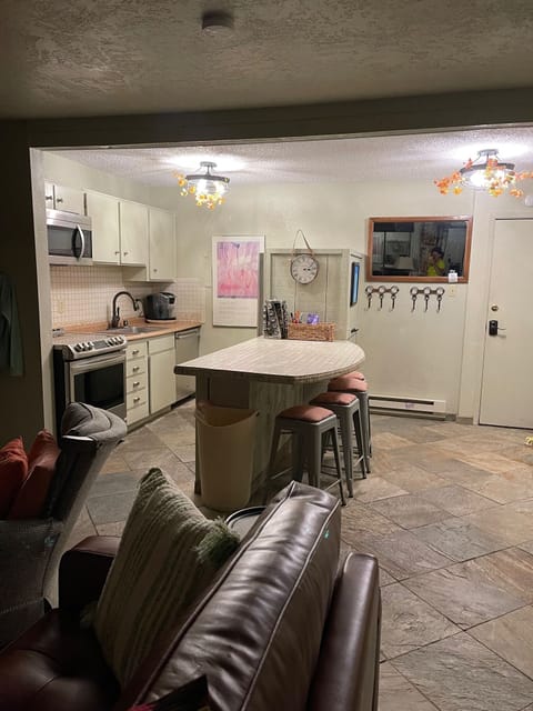 Bright kitchen opens up into den area.