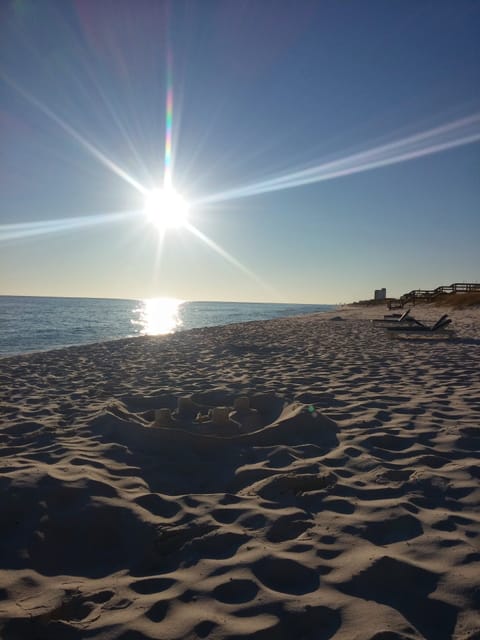 On the beach, sun loungers, beach towels