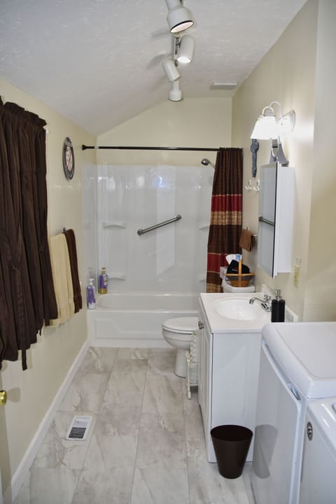 Combined shower/tub, hair dryer, towels, soap