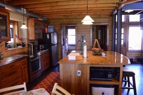 Another view of the kitchen and island