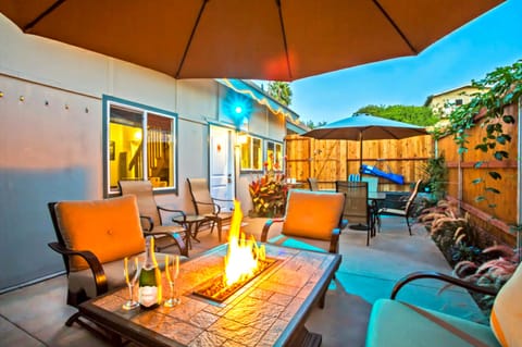Enjoy the private outdoor patio with fire table, BBQ, and dining table.