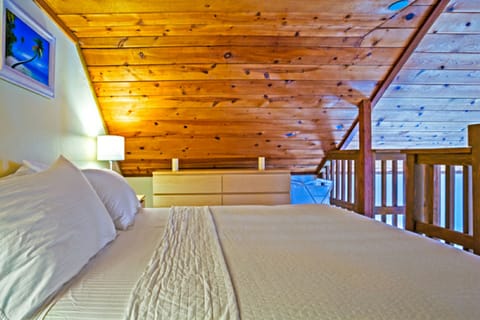 Cozy second bedroom is open to the floor below