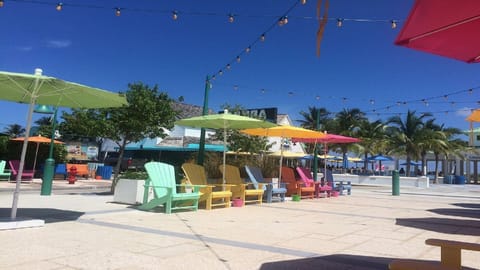 Enjoy a session or relaxation underneath one of these bright tropical umbrellas.