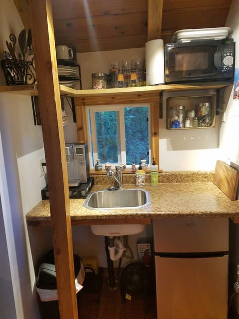 Fridge, microwave, coffee/tea maker, cookware/dishes/utensils