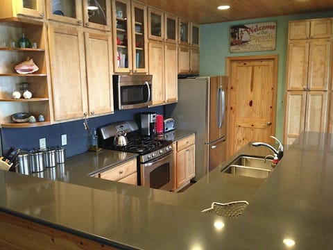 Fully equiped kitchen with great view of Joe Creek and the ocean.