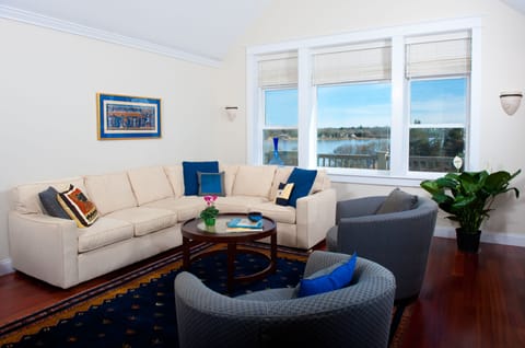 Gather in the living room with views of great salt pond, open to DR and kitchen.