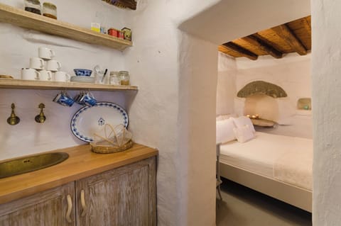 Master bedroom in the lower cottage, has kitchenette next to twin bedroom