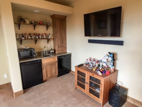 Wet bar area by the pool table in the loft