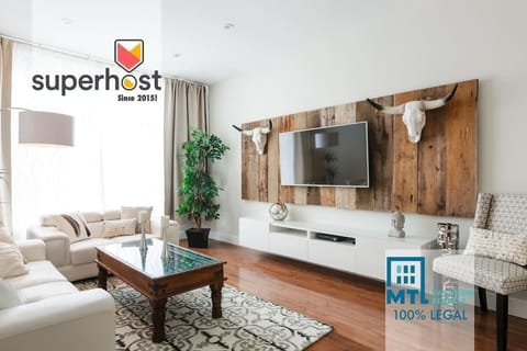 We are Superhost since 2015, with over a 1000 great reviews ! We have all the city permits and insurance required.                 *** 100% LEGAL ***This is the wide and bright living room with 55" Smart Roku HD TV with cable. Log in to your (Netflix, Disney +, Prime...) accounts. Contact us!