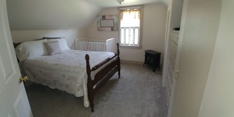 Upstairs bedroom with crib