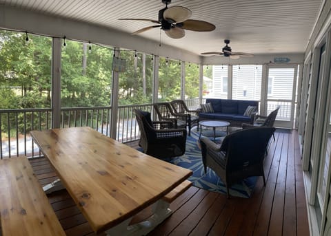 relax on the porch and enjoy eating or playing games on the picnic table.