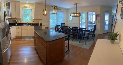 kitchen opens to the main living room and 2 screen porches
