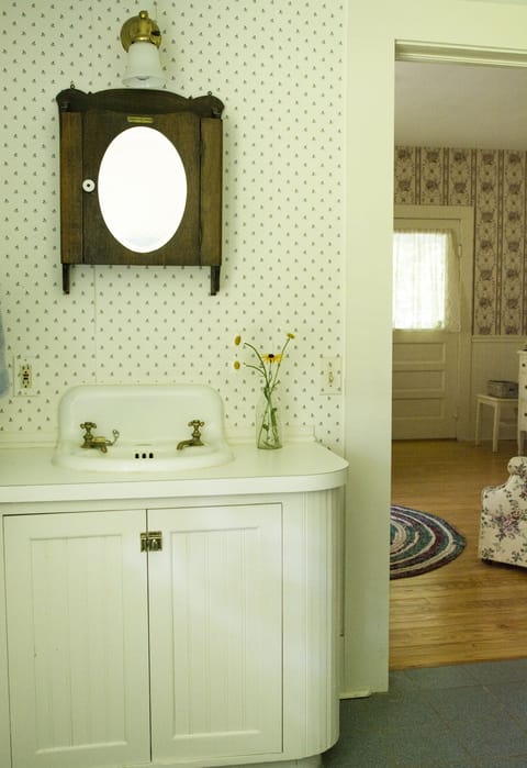 The downstairs bedroom has an adjoining full bathroom with a tub/shower