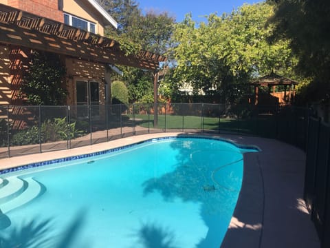 Backyard, with a gorgeous pool and a gazebo.