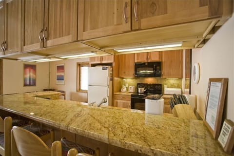 The breakfast bar seats four and faces into the kitchen