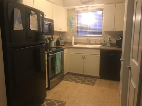 Microwave, dishwasher, coffee/tea maker, cookware/dishes/utensils