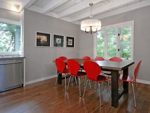 Dining area - seats 6-8 at table, two at bar, and 4 more in adjacent living room