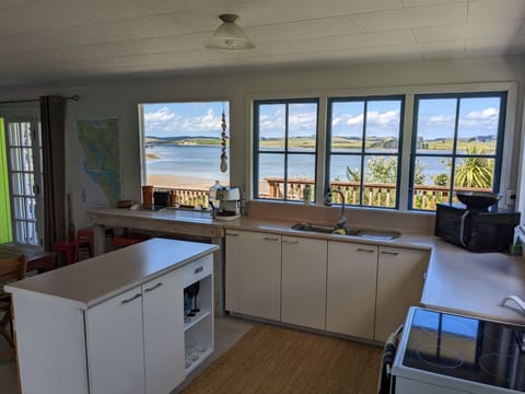Kitchen w/ Fridge, Stovetop oven, Microwave, Coffee Machine + crockery & Pots