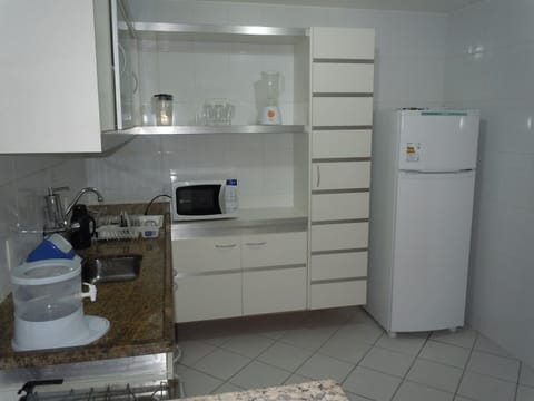 Fridge, microwave, stovetop, cookware/dishes/utensils